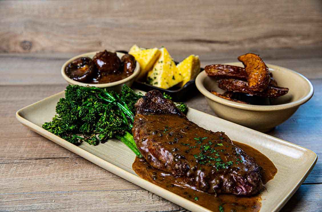 savory steak with side dishes